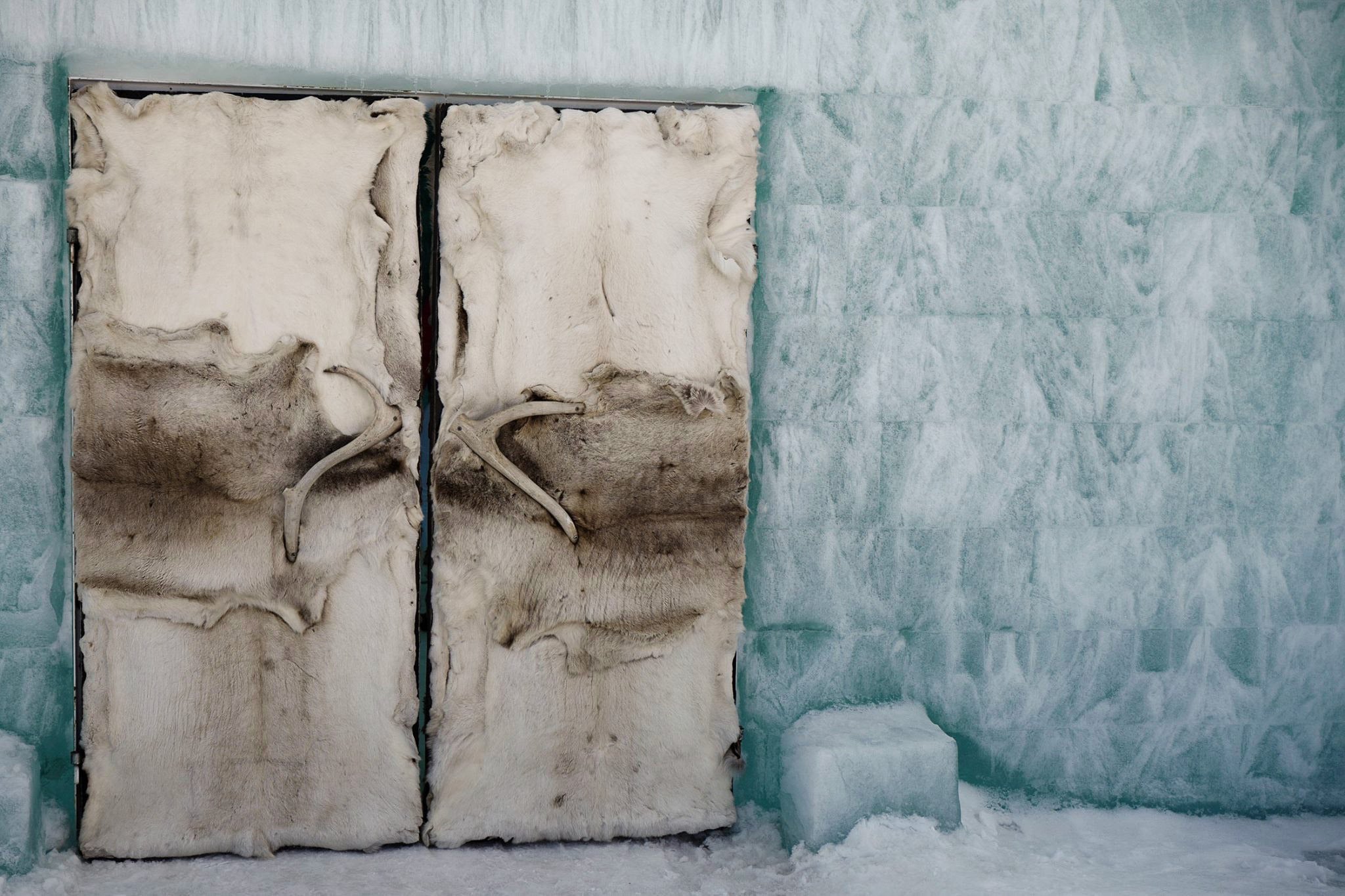 Reindeer-Hide Doors in an Ice Wall - Ice Hotel Photography