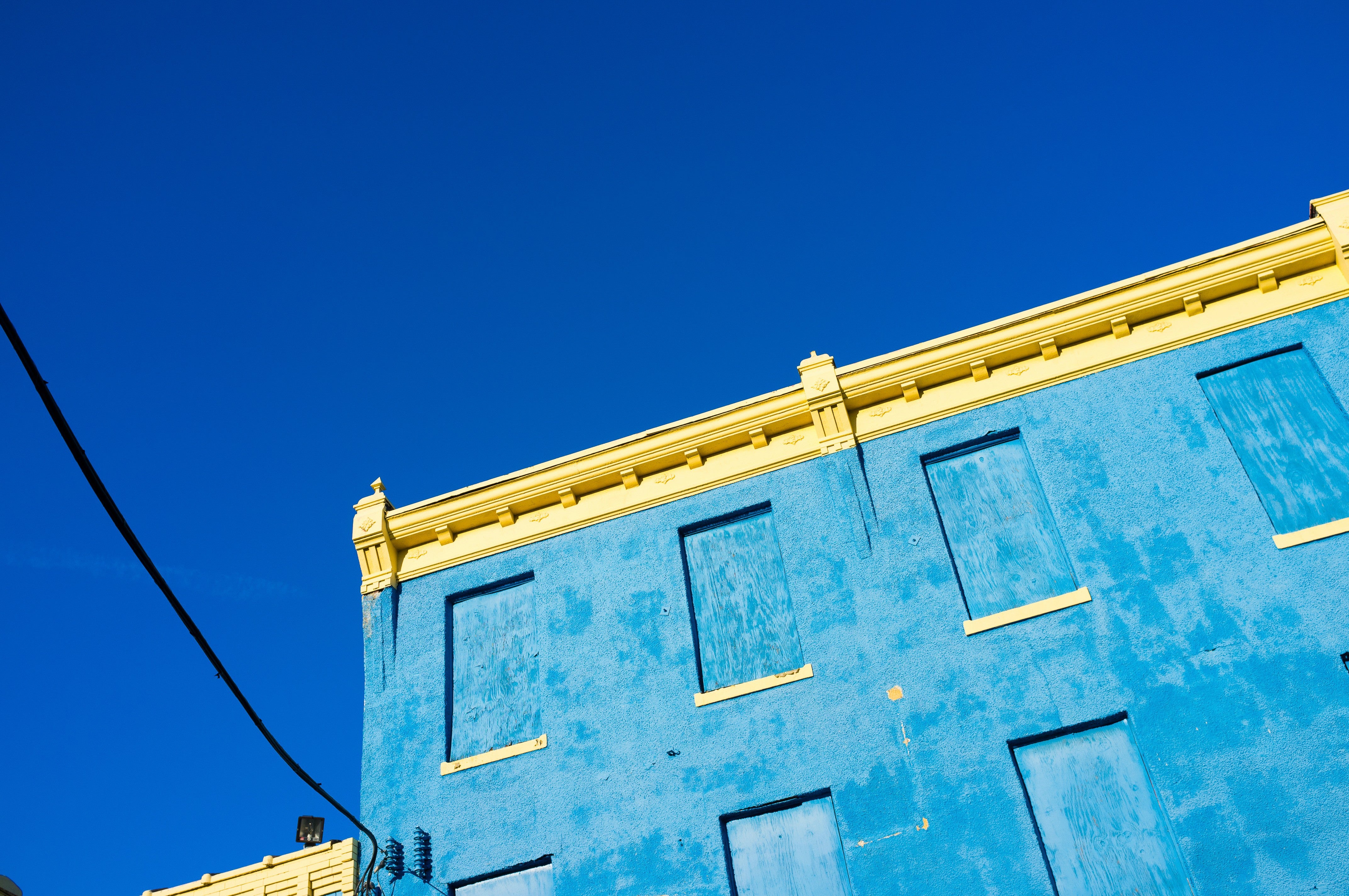 Blue and Yellow Facade Against Sky - Minimal Architecture Photography