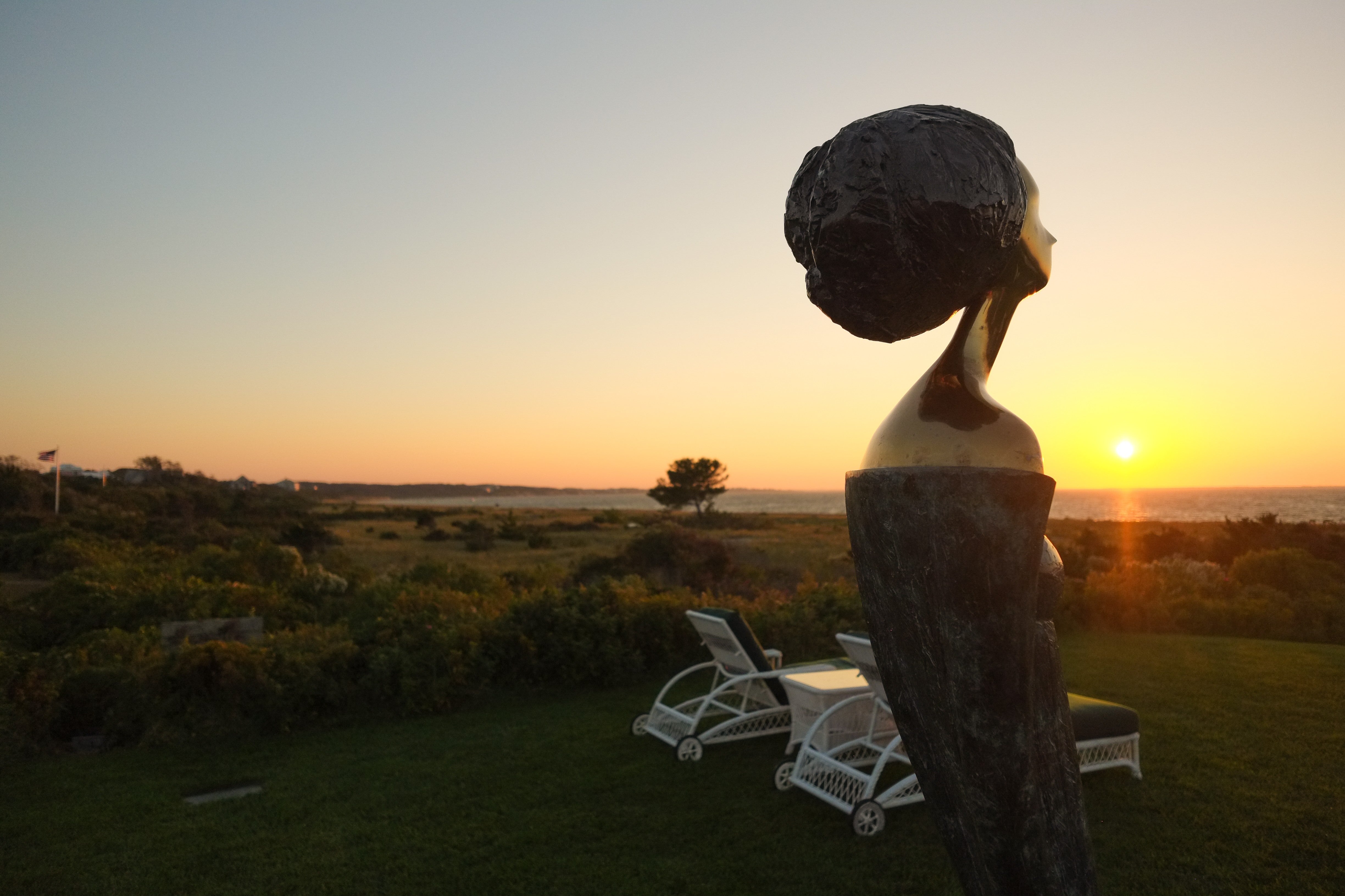 Bronze Bust Sculpture at Sunset - Coastal Silhouette Photography