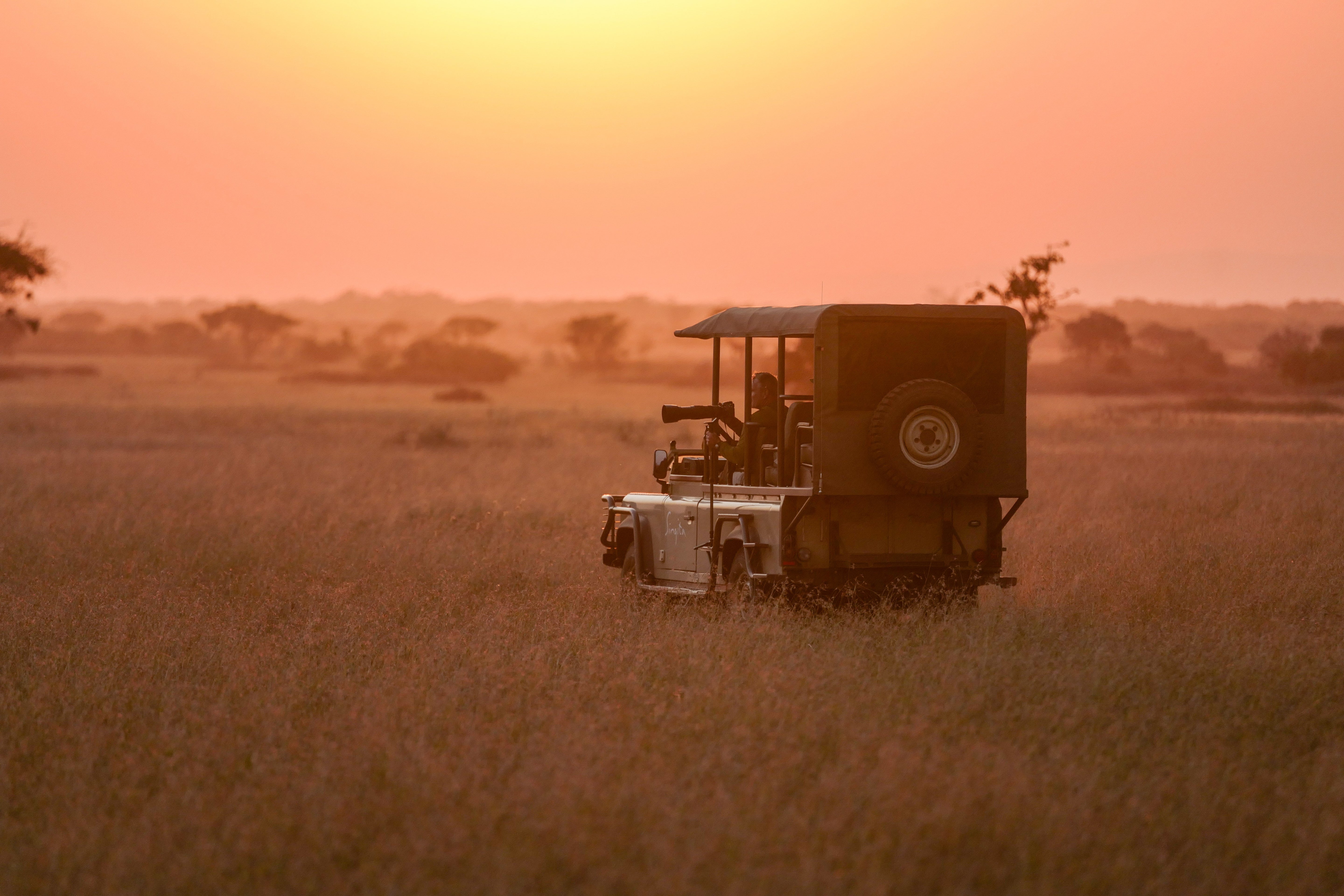 Safari Vehicle at Sunset - Serengeti Golden Hour Photography