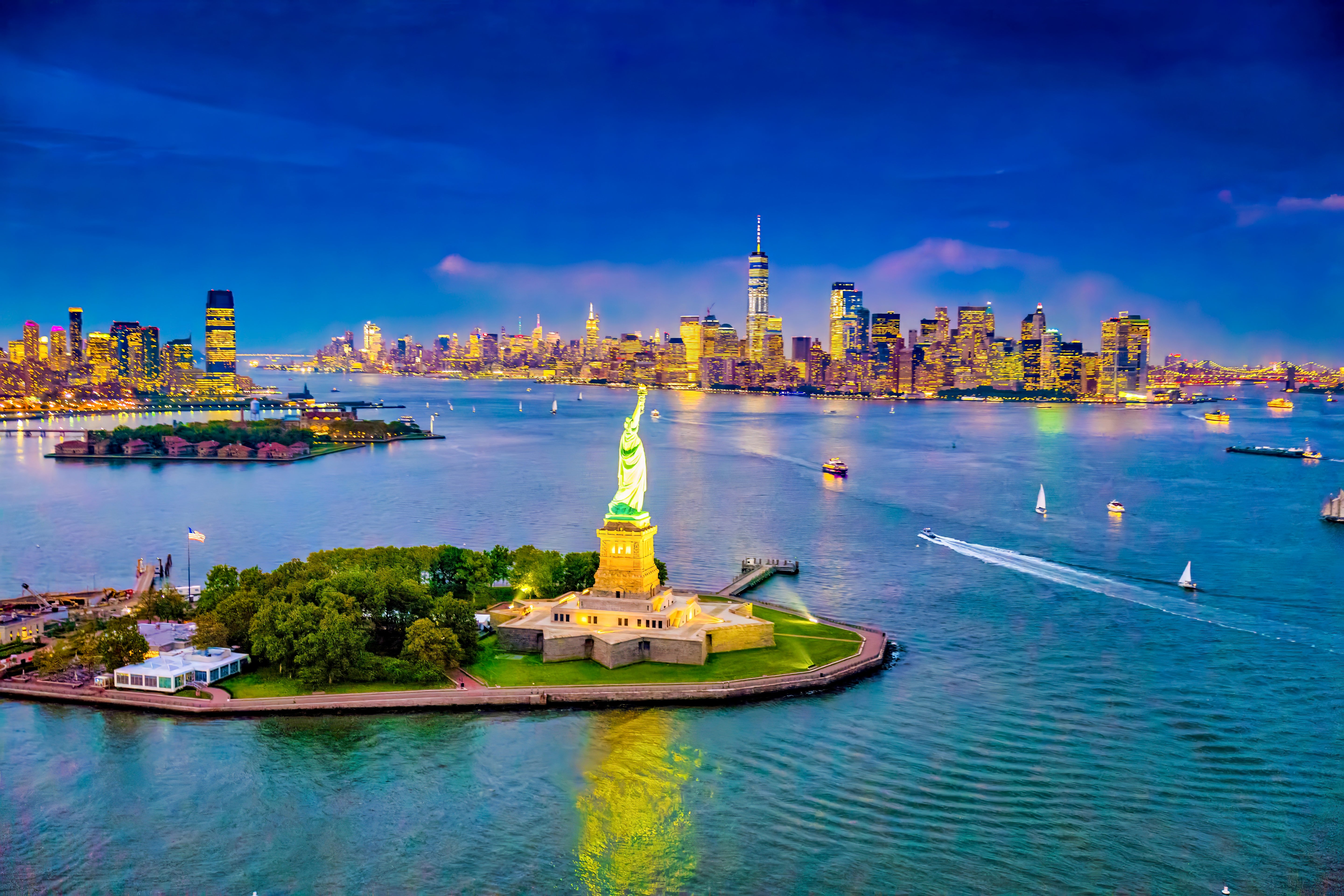 Statue of Liberty and Manhattan at Dusk - Aerial Cityscape Photography